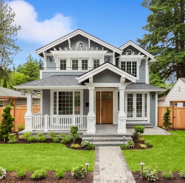 new luxury home with elegant touches including covered entrance, columns